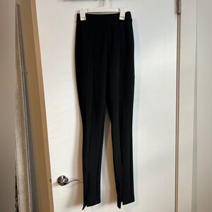 Black ribbed leggings with slits at the bottom